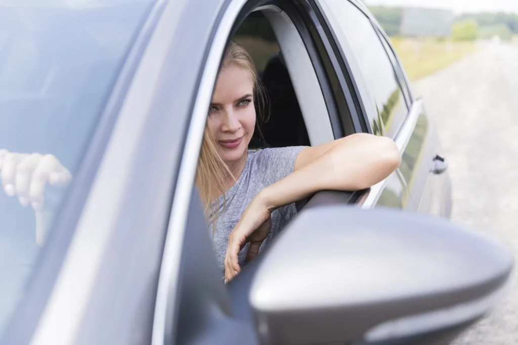 front view blonde woman driving Moncloa