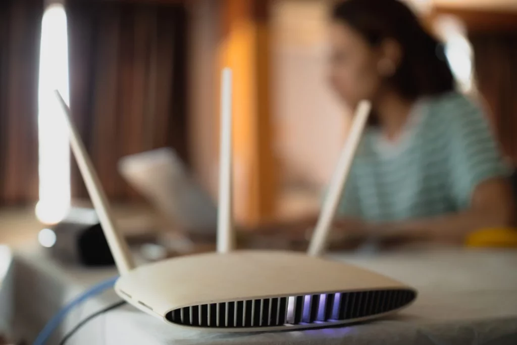 woman is working home using modem router connecting internet her laptop Moncloa