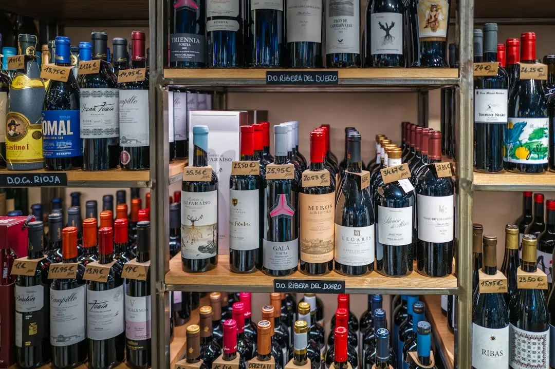 Bottles of wine displayed on shelves in a store